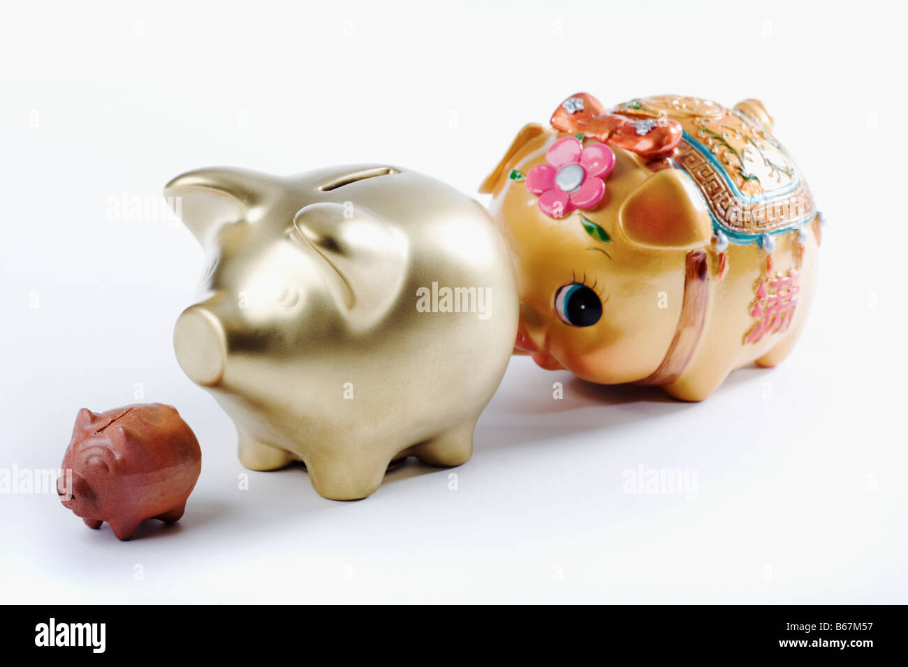 Close-up di salvadanaio di tre banche in una riga Foto Stock
