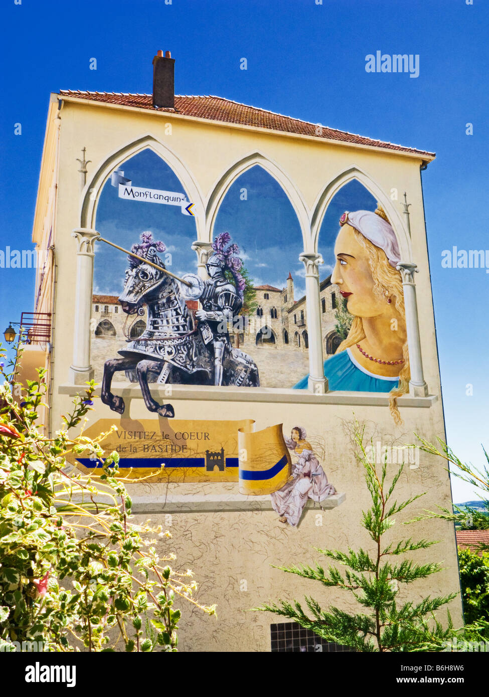 Murale dipinto sul lato di un muro di casa in Monflanquin Lot et Garonne sud-ovest della Francia Europa Foto Stock