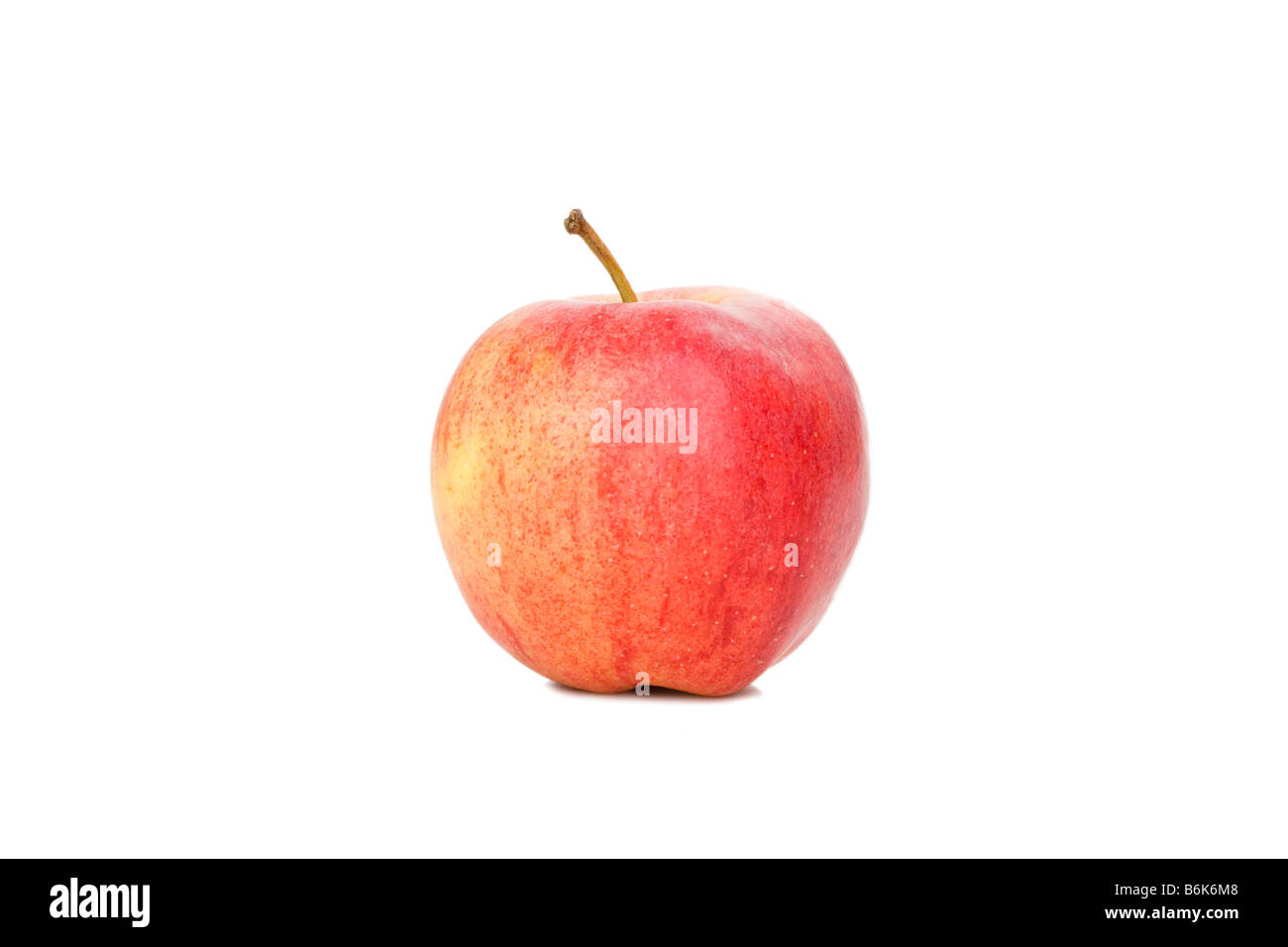 Unico apple con colorazione rosso su bianco Foto Stock