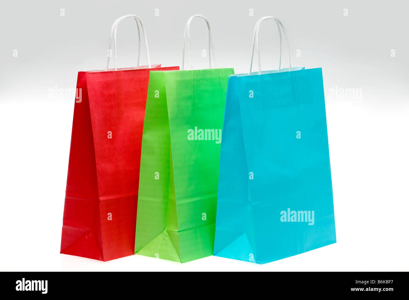 Tre carta colorata borse per lo shopping Foto Stock