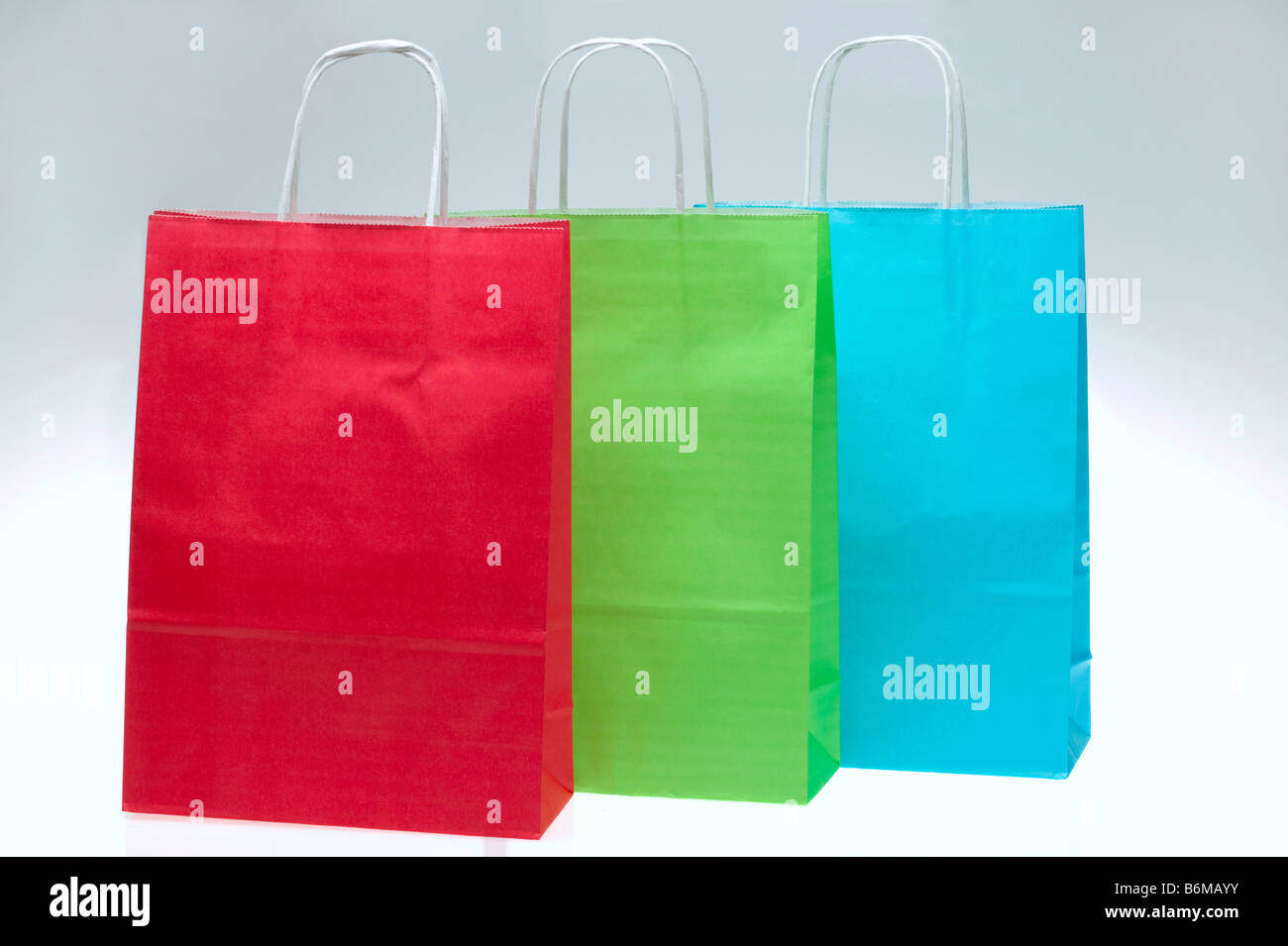 Rosso Verde e Blu della carta borse per lo shopping Foto Stock