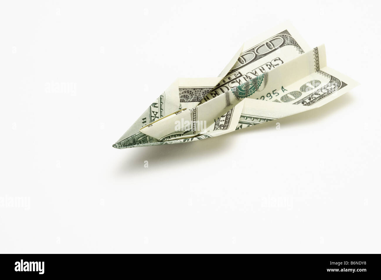 Aeroplano di carta fatta da carta moneta Foto Stock