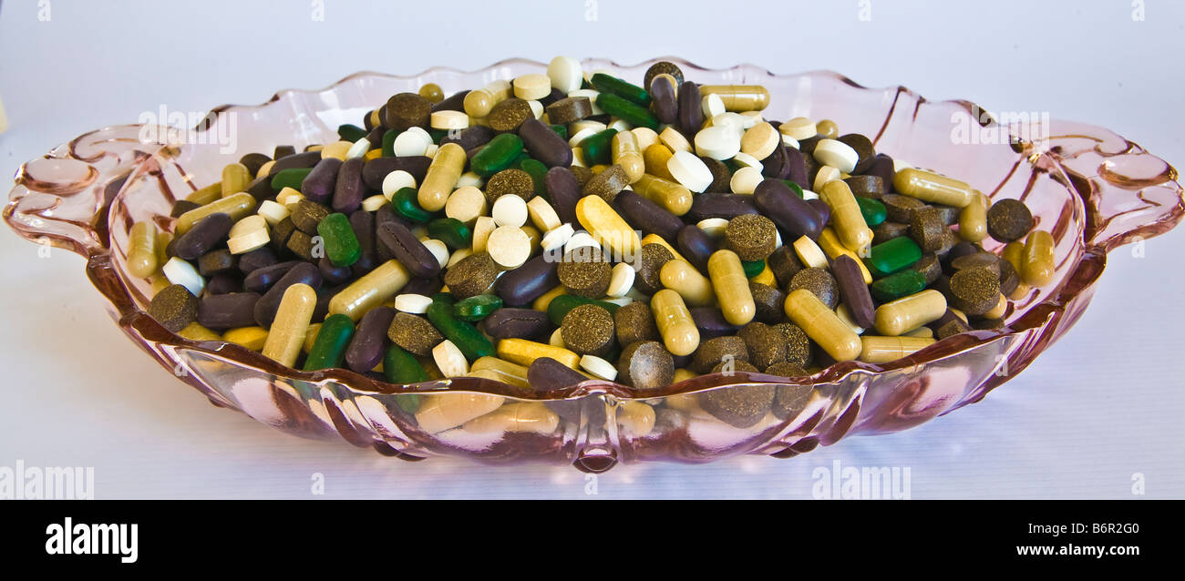 Candy piatto pieno di multi-pillole colorate Foto Stock