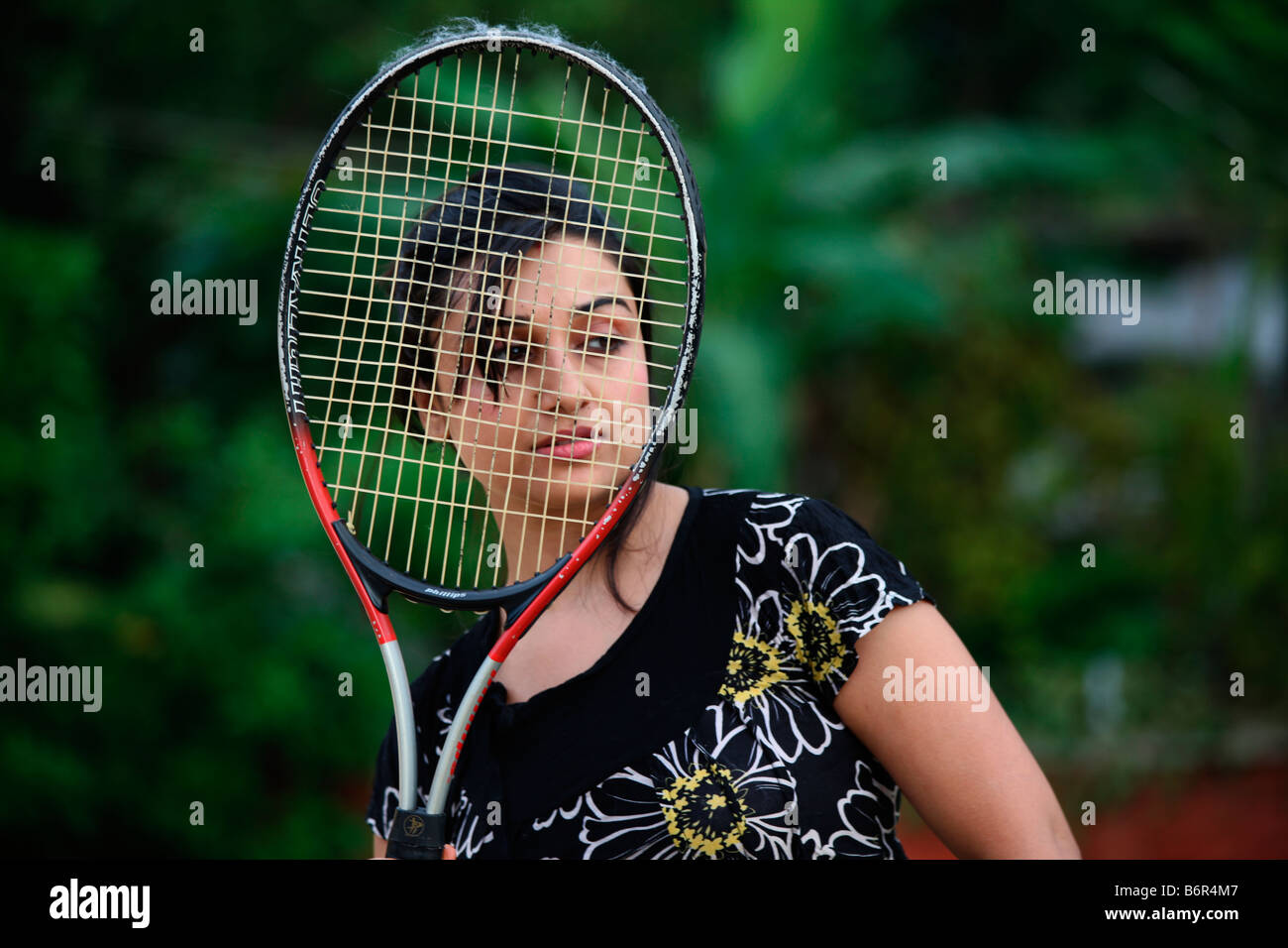 Un modello indiano con badminton racchetta Foto Stock