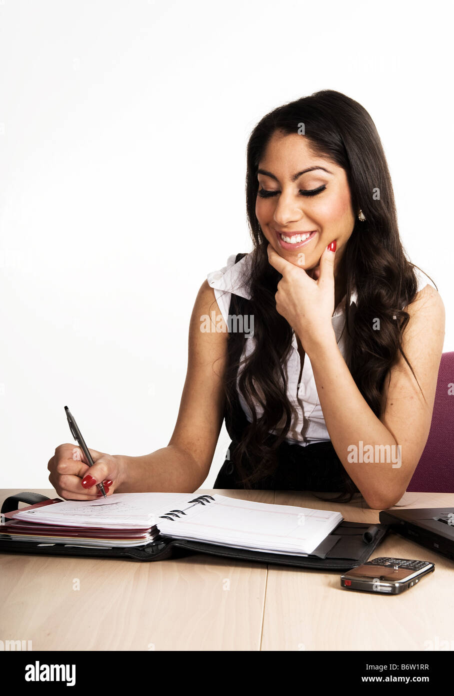 Business donna lavorando sul suo calendario Foto Stock