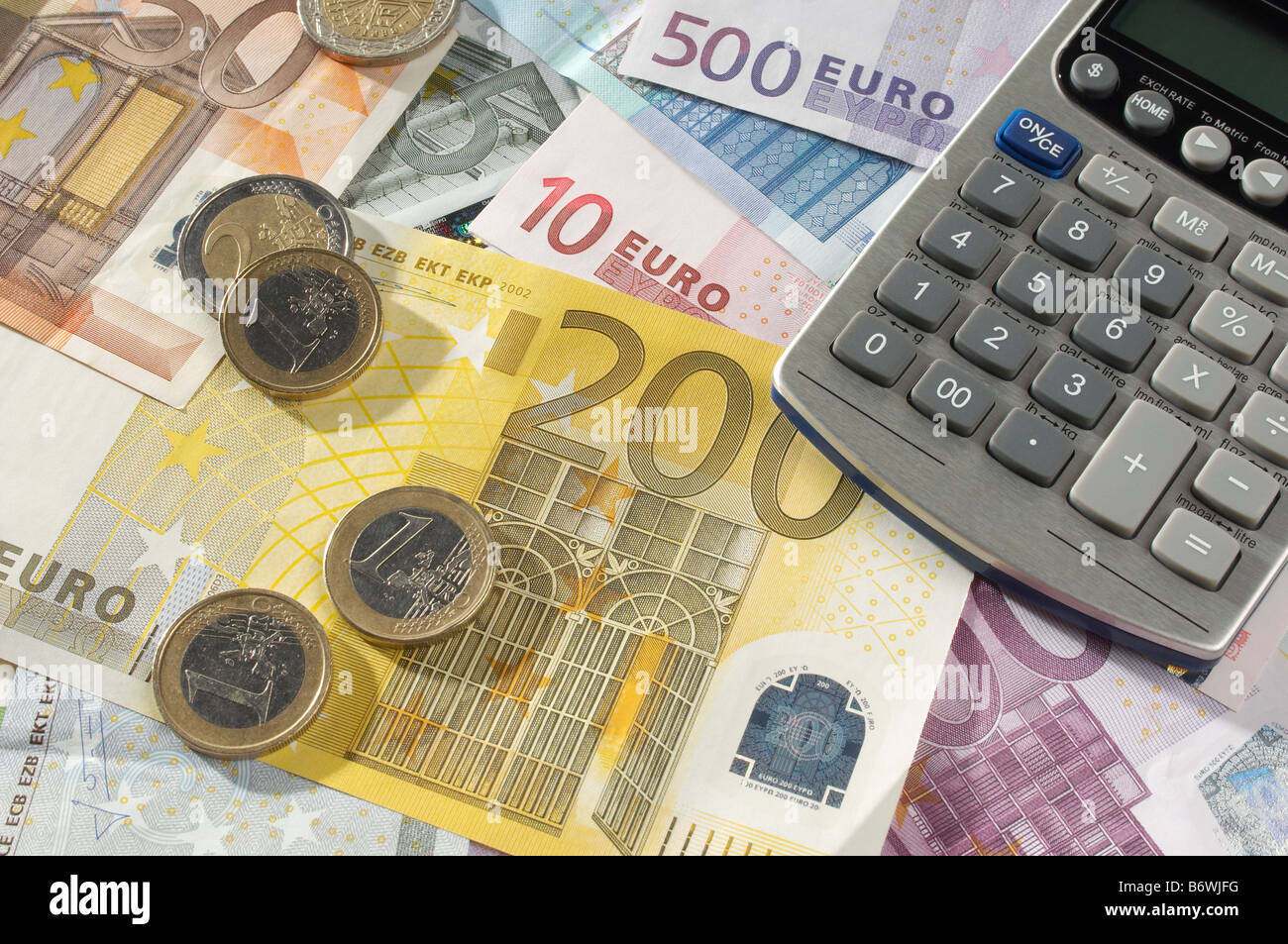 Il denaro e la calcolatrice Foto Stock