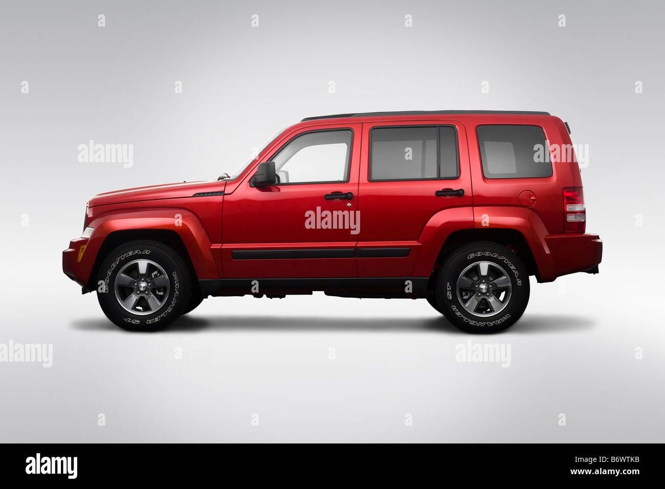 2009 Jeep Liberty Sport in rosso - Driver Profilo laterale Foto Stock