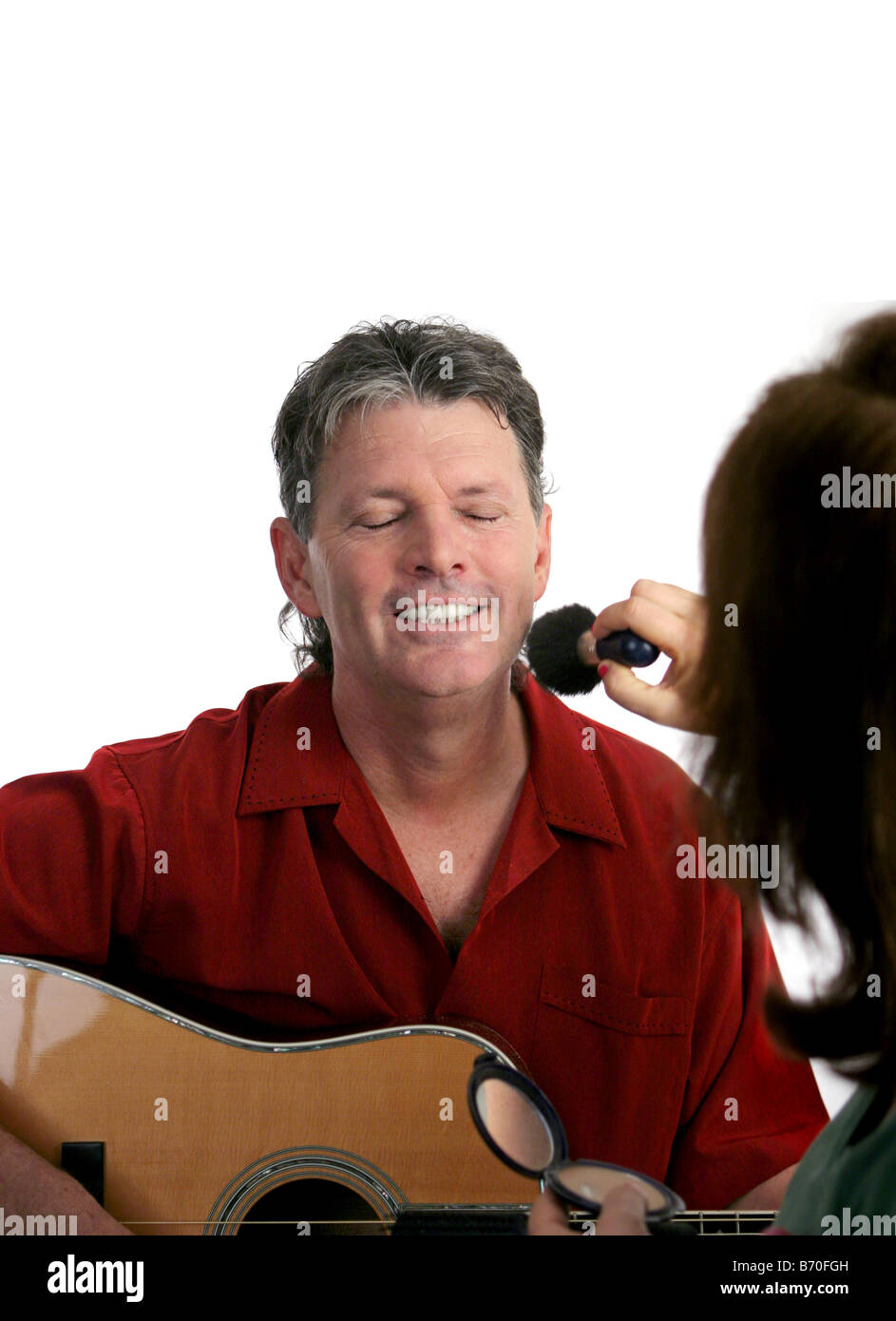 Un musicista professionista getting fatta prima di andare sul palco Foto Stock