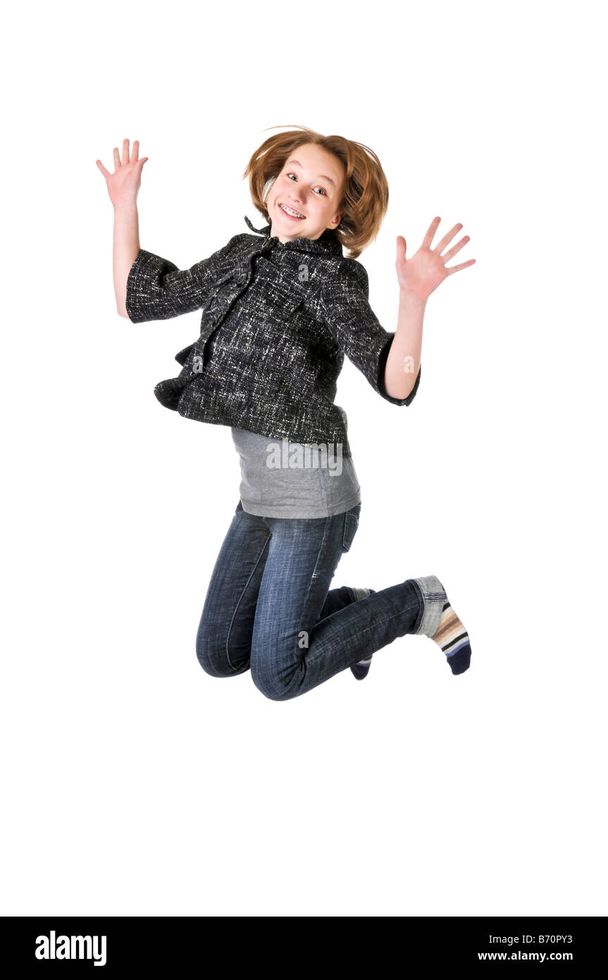 Ragazza adolescente jumping isolati su sfondo bianco Foto Stock