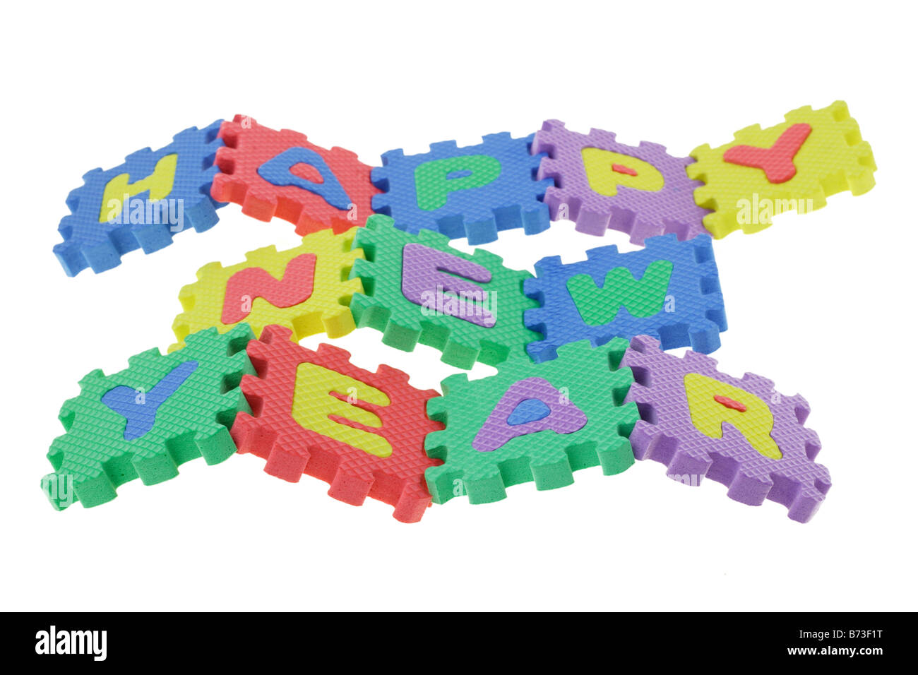 Alfabeto colorato blocchi puzzle assemblati per visualizzare Felice Anno Nuovo Foto Stock