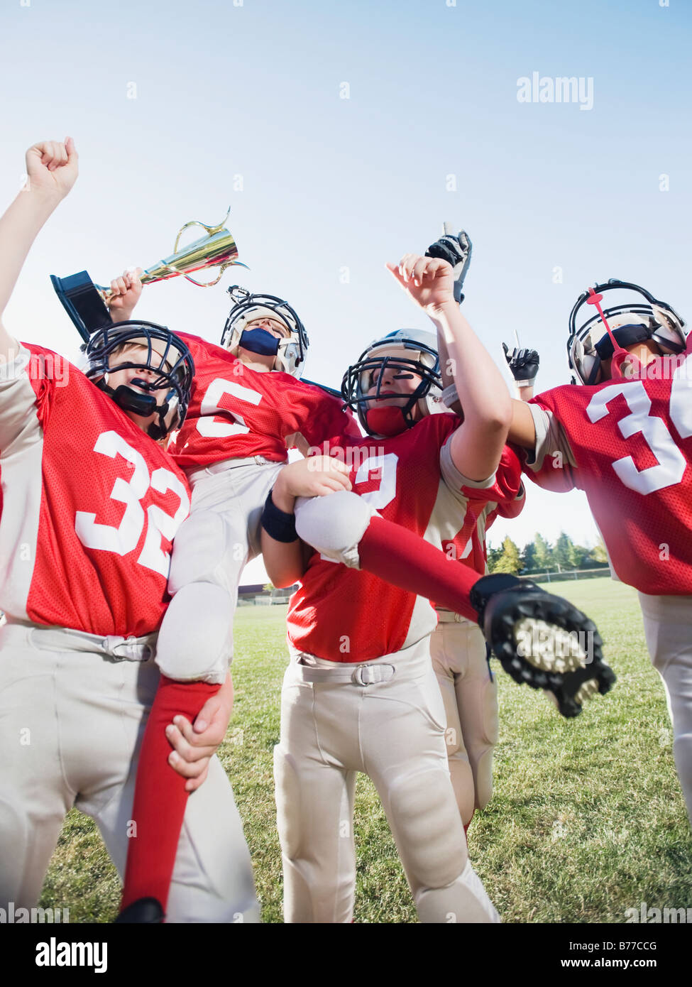 La squadra di football celebra il trofeo Foto Stock