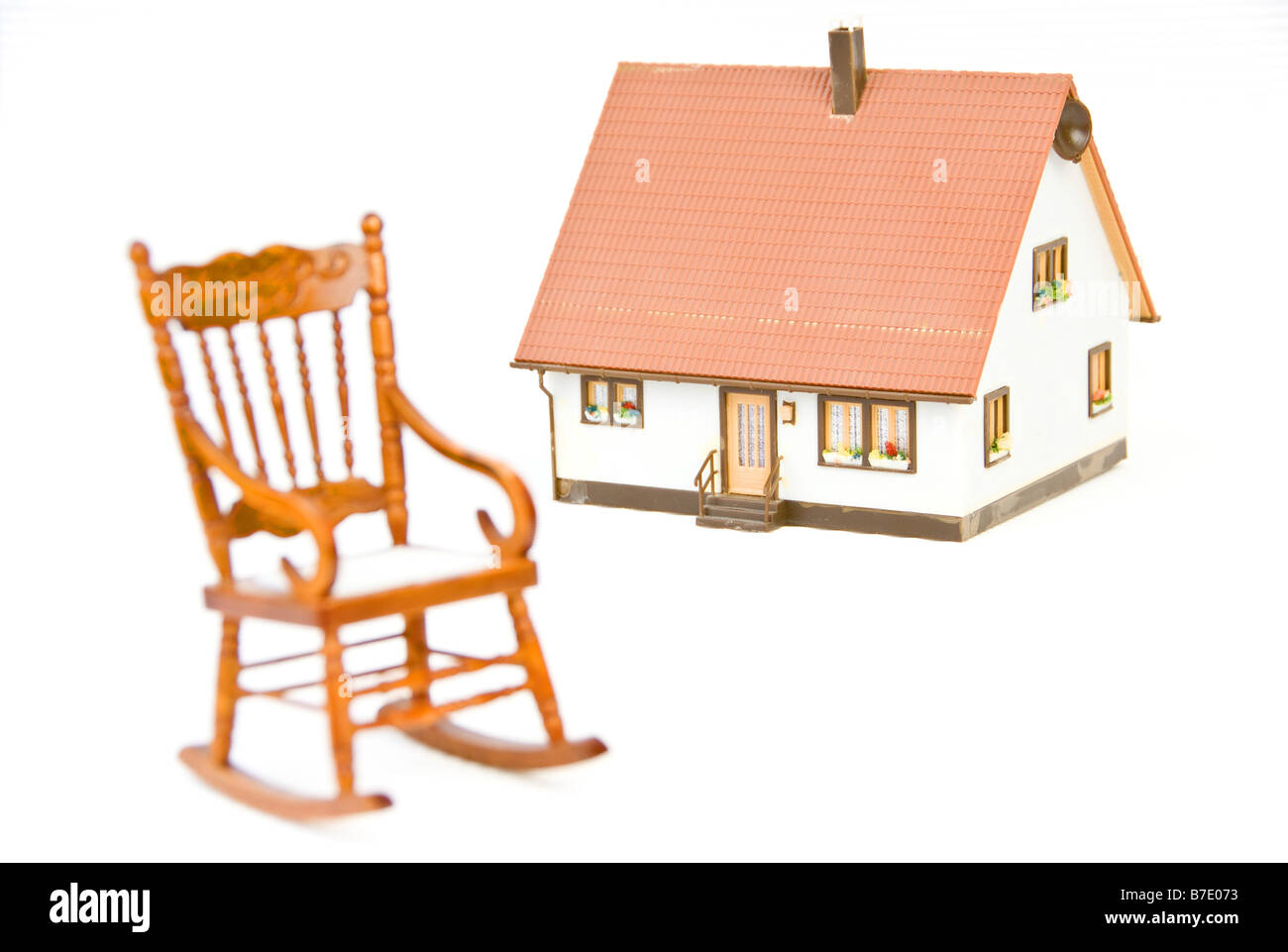 La sedia a dondolo e casa Foto Stock