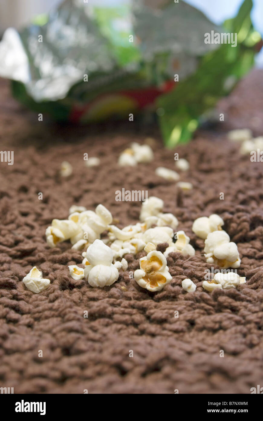 Il popcorn sul tappeto Foto Stock
