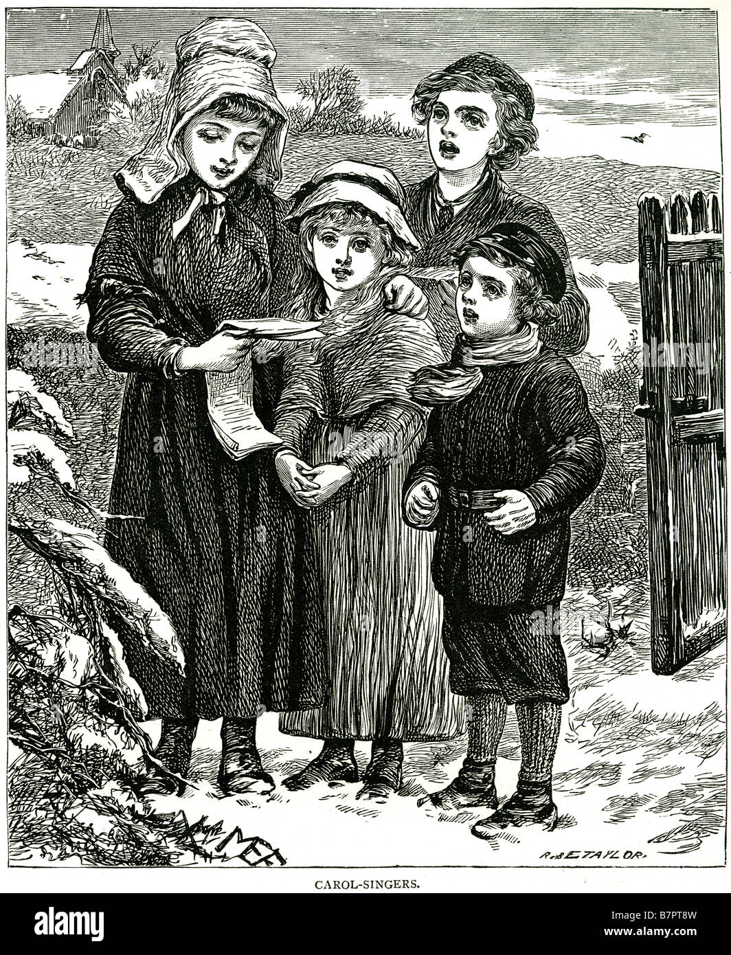 Carol cantanti neve invernale giardino freddo Natale Bambini bambini Abbigliamento tradizionale Foto Stock
