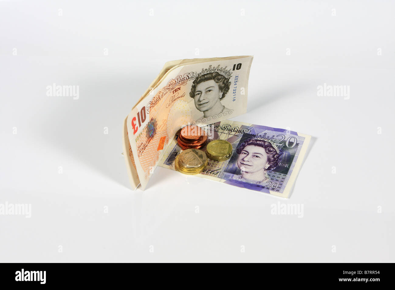 £10, £20 banconote e monete metalliche Foto Stock