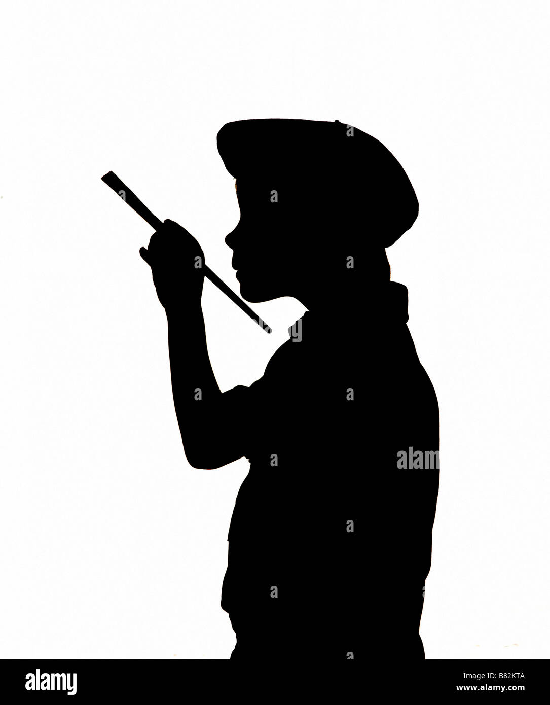 Silhouette di un ragazzo essendo pittore indossando berrat francese Foto Stock