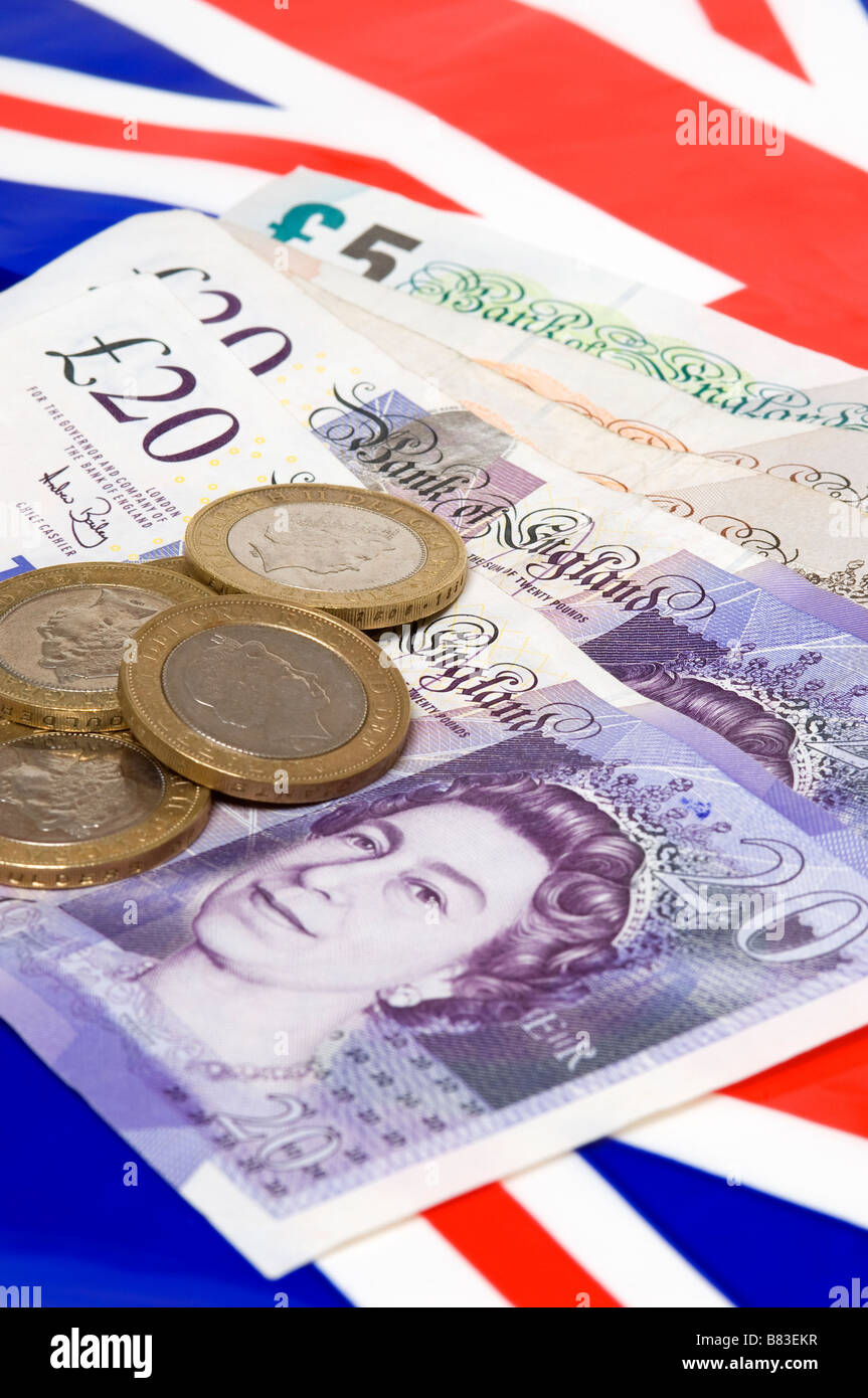 Inglese UK money close up con Union Jack bandiera nel concetto di finanza di fondo Foto Stock
