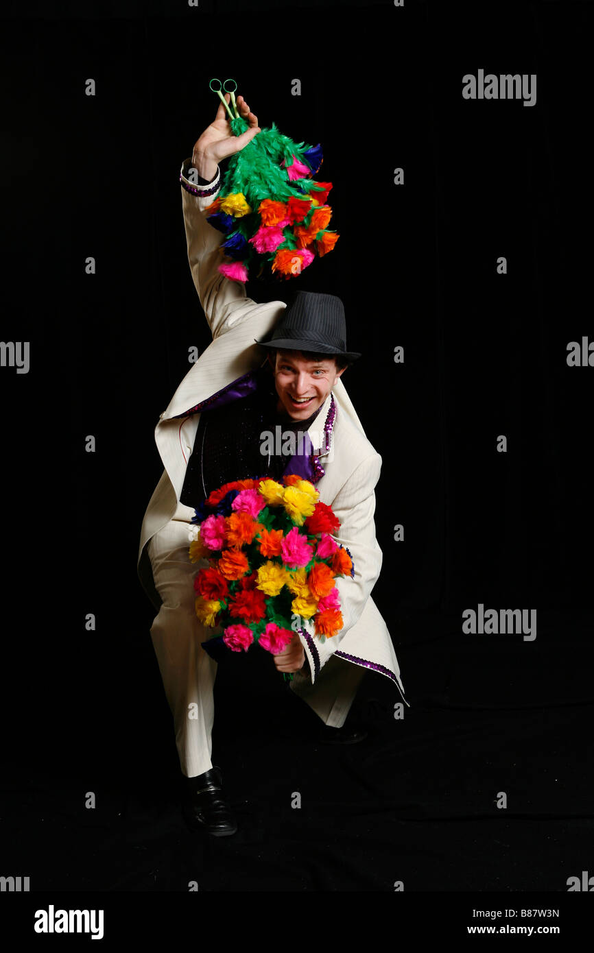 Jezo magic clown con il dono dei fiori Foto Stock