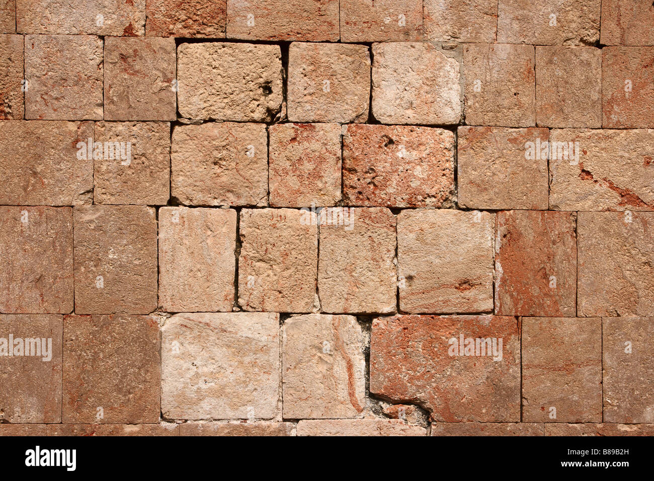 La texture del muro di pietra di antiche rovine Maya in Messico Foto Stock