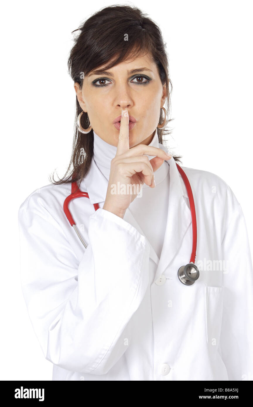 Attraente dama medico ordinazione di silenzio su uno sfondo bianco Foto Stock