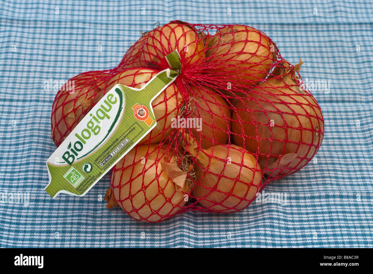 1 kilo sacco / net di Francese / organico Biologique cipolle. Foto Stock