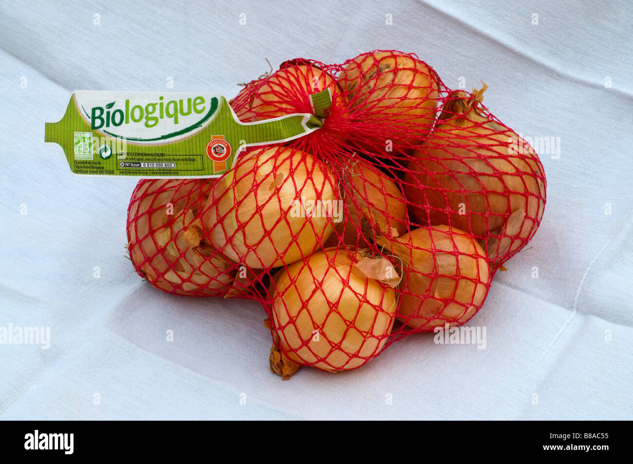 1 kilo sacco / net di Francese / organico Biologique cipolle. Foto Stock