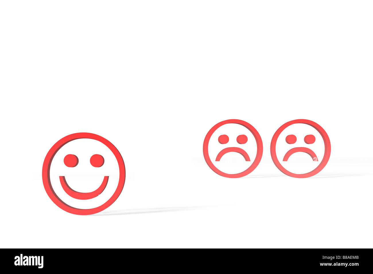 Tre rossi smileys, una sorridente, due infelici, contro uno sfondo bianco. Foto Stock