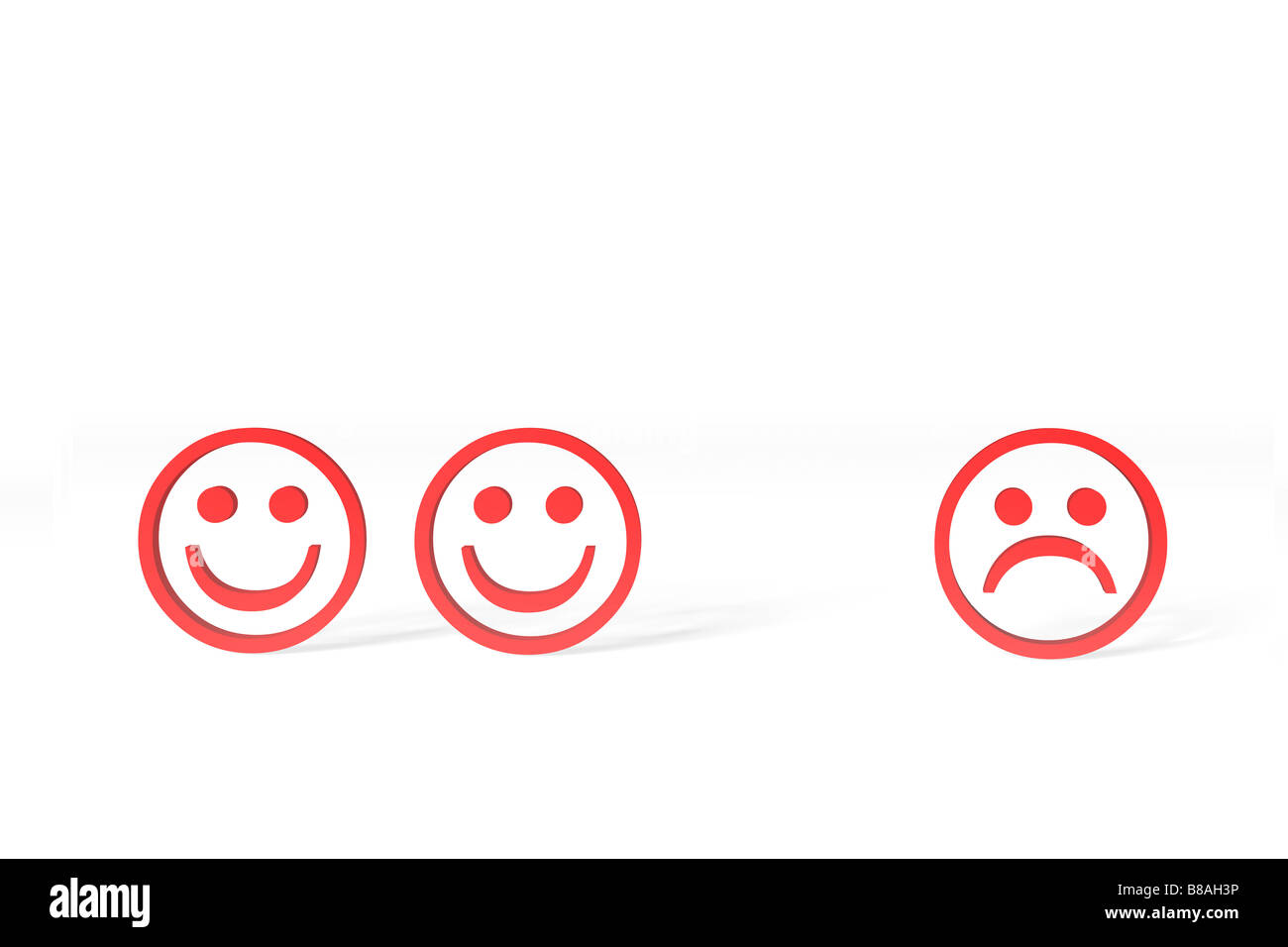 Tre rossi smileys, due sorridenti, uno infelice, contro uno sfondo bianco. Foto Stock