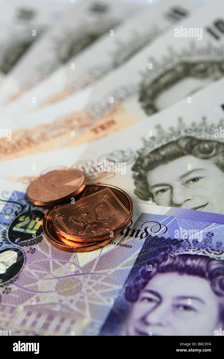 Sterling banconote e monete Foto Stock