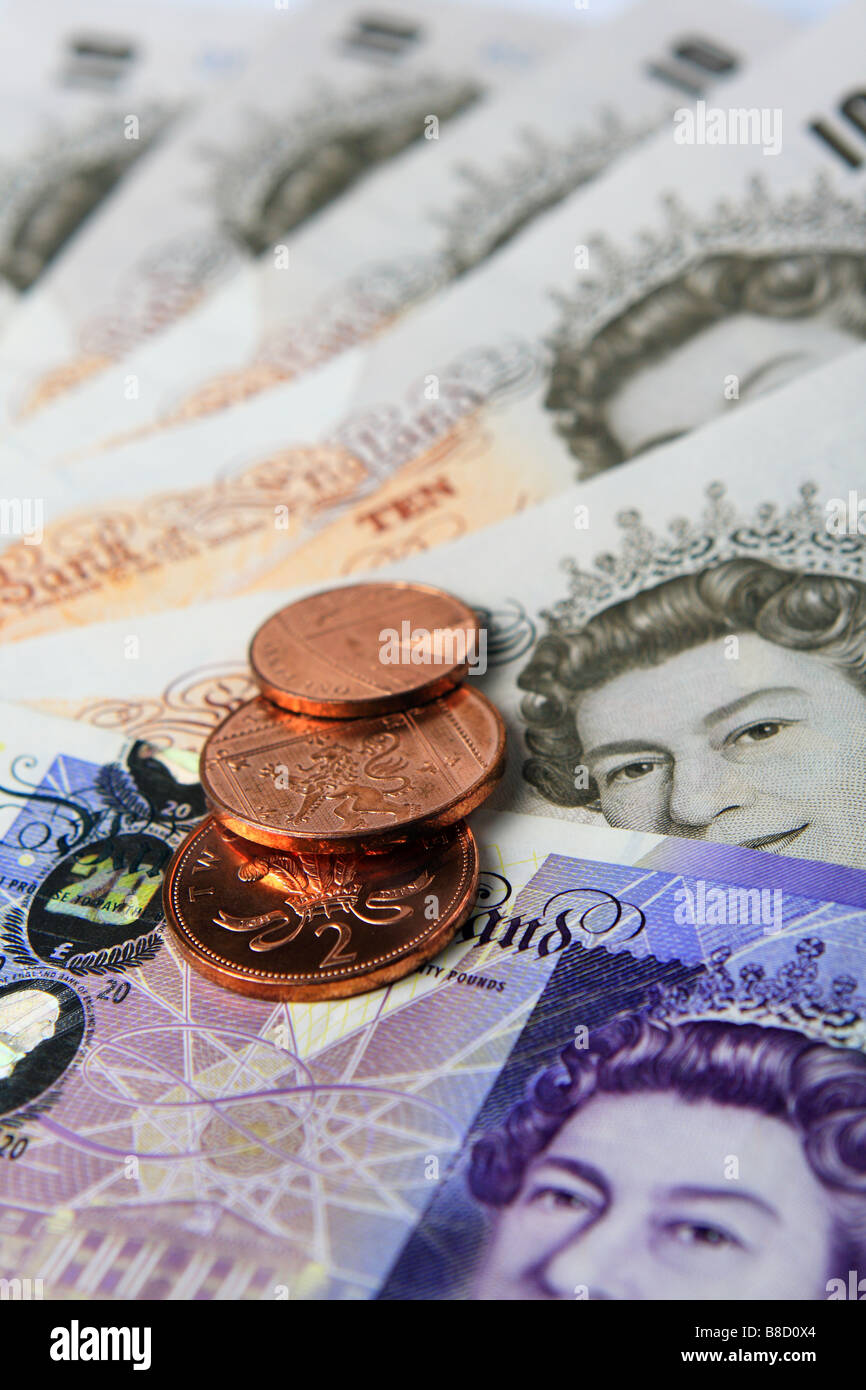 Sterling banconote e monete Foto Stock