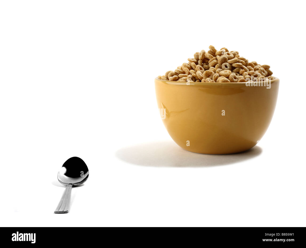 Cereale nella ciotola con il cucchiaio Foto Stock