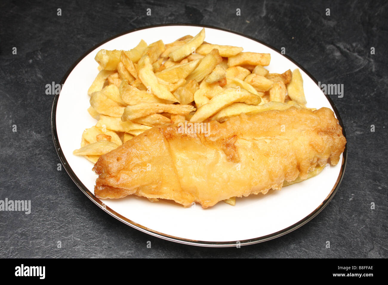 Pesce e patatine da un chip shop. Foto Stock