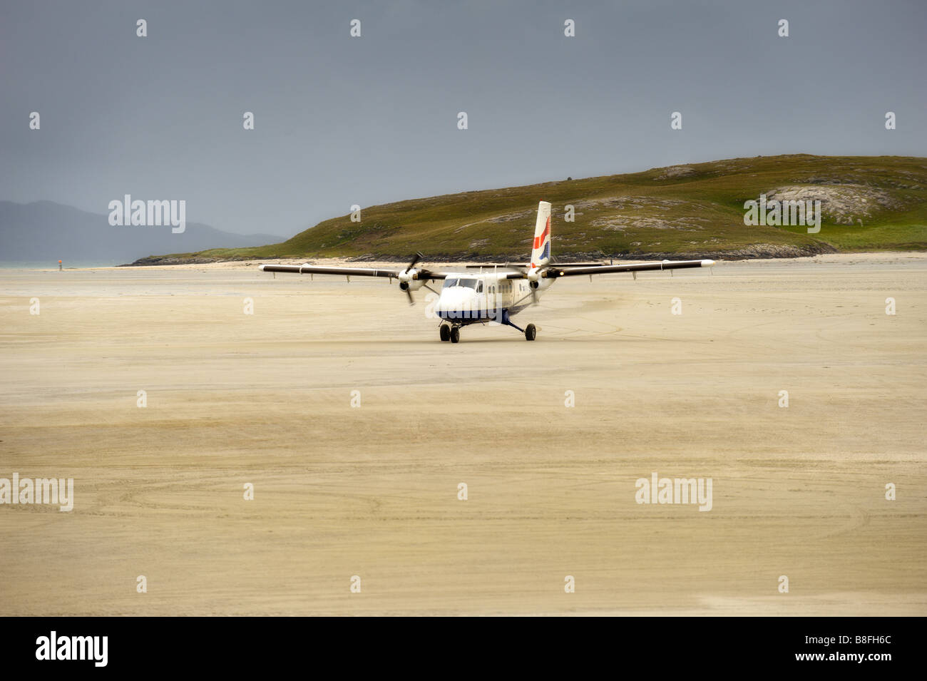 Aerei di atterraggio sulla spiaggia di Barra aeroporto Western Isles Foto Stock