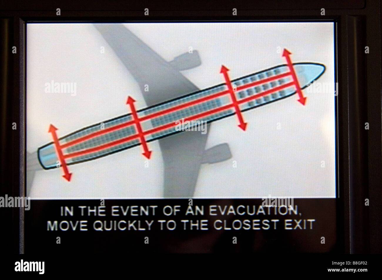 Istruzioni di sicurezza sul retro del poggiatesta del sedile in aereo Foto  stock - Alamy