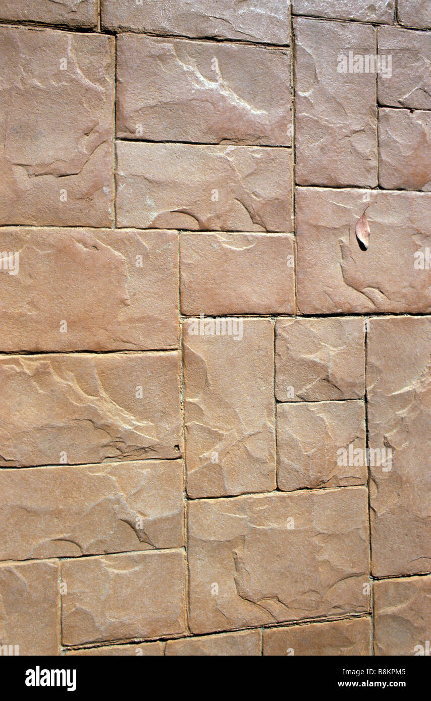 Pattern in incastro dei blocchi di pietra della parete di edificio Foto Stock