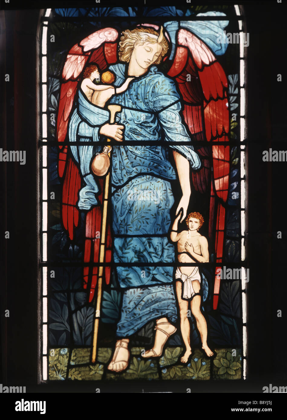 Angelo custode di vetro macchiato da Burne-Jones chiesa di St Michael Fordern Galles Foto Stock