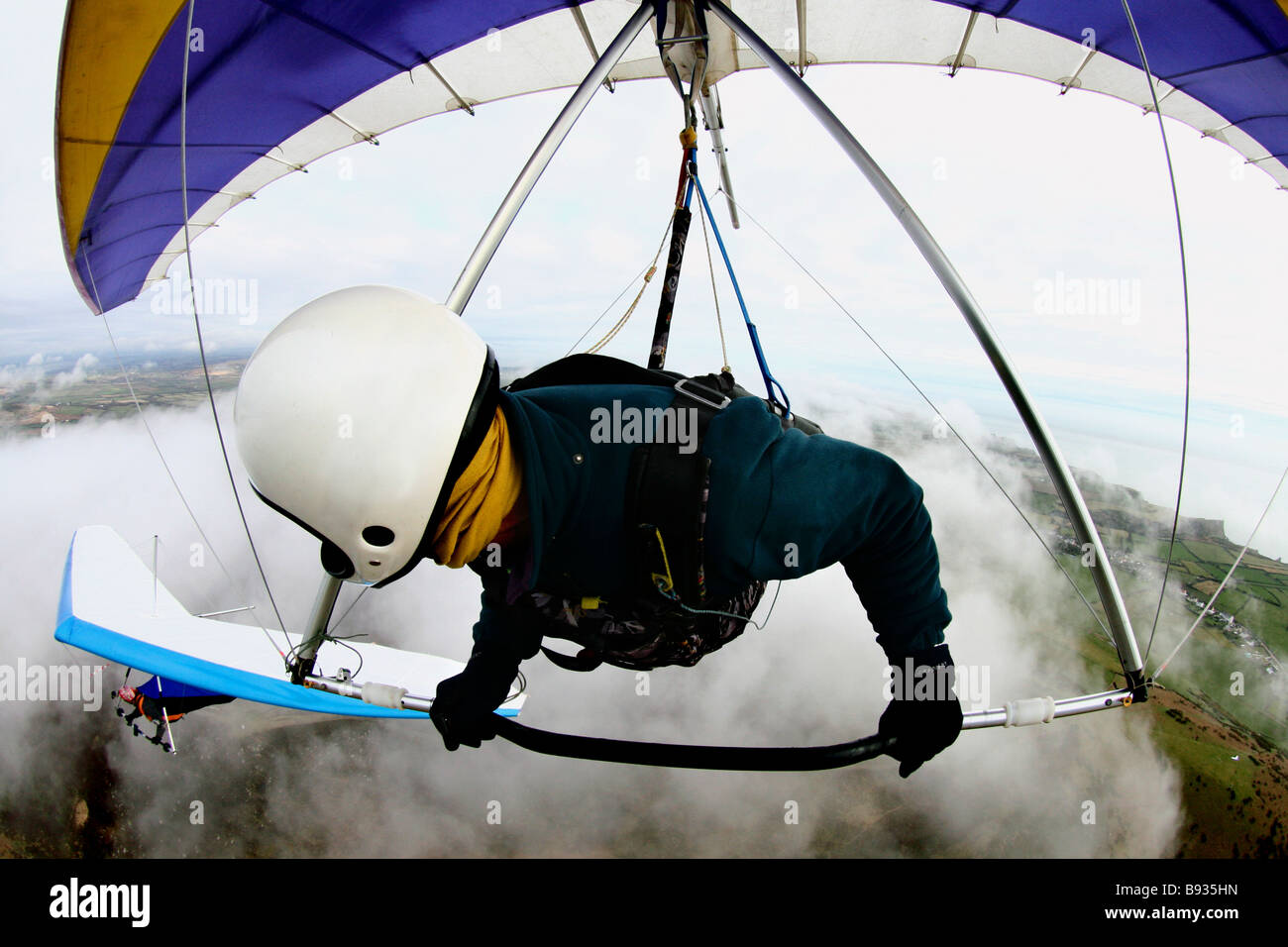 Deltaplano in volo shot Rhossili Wales UK Foto Stock