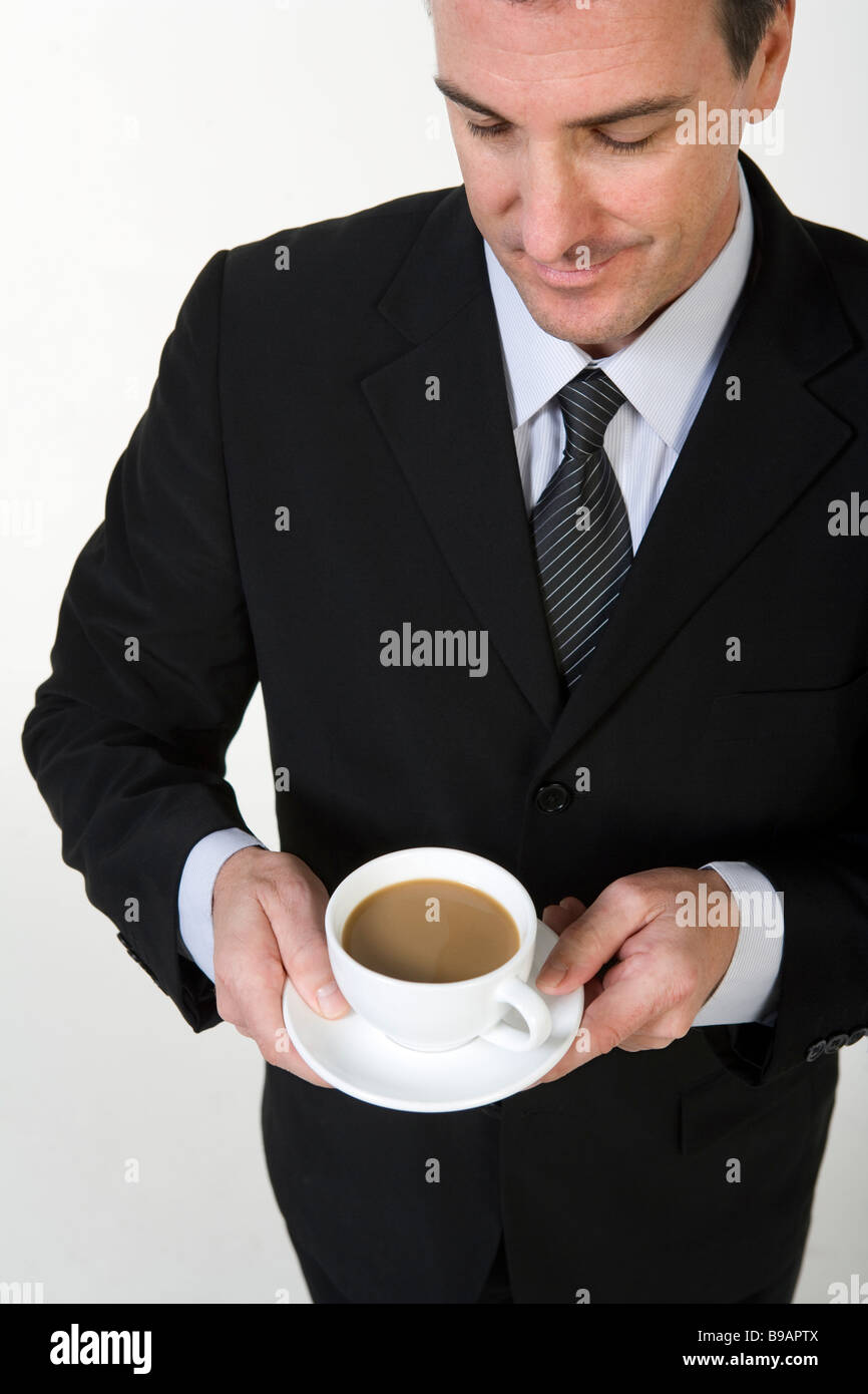 Imprenditore azienda tazza di caffè Foto Stock