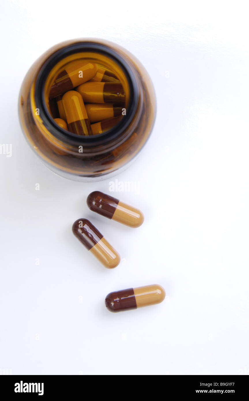 Vetro-fiala apertamente le capsule in due colori vista dall'alto serie medicina medicina vitamina-capsule vitamina-preparazione cibo-supplemento Foto Stock