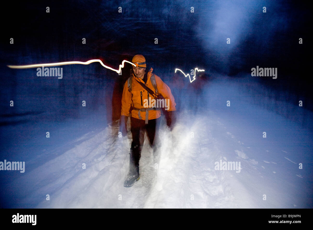 Arrampicata su ghiaccio, New Hampshire, al tramonto. (Otturatore trascinare) Foto Stock