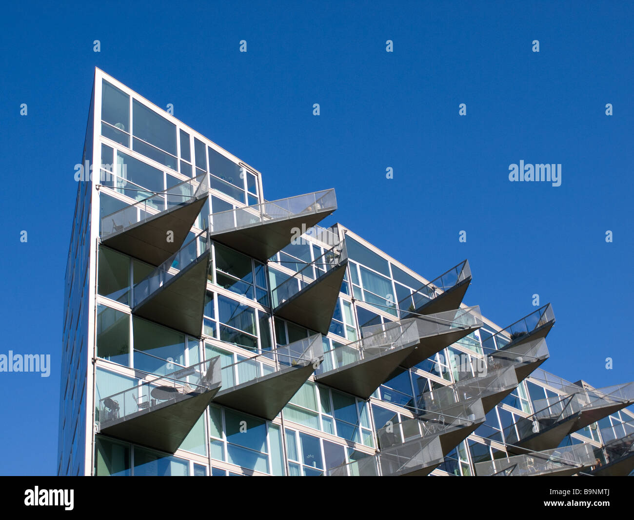 Il molto triangolare di VM-Husene edificio residenziale, situato nel quartiere di Ørestad di Copenhagen, Danimarca. Foto Stock