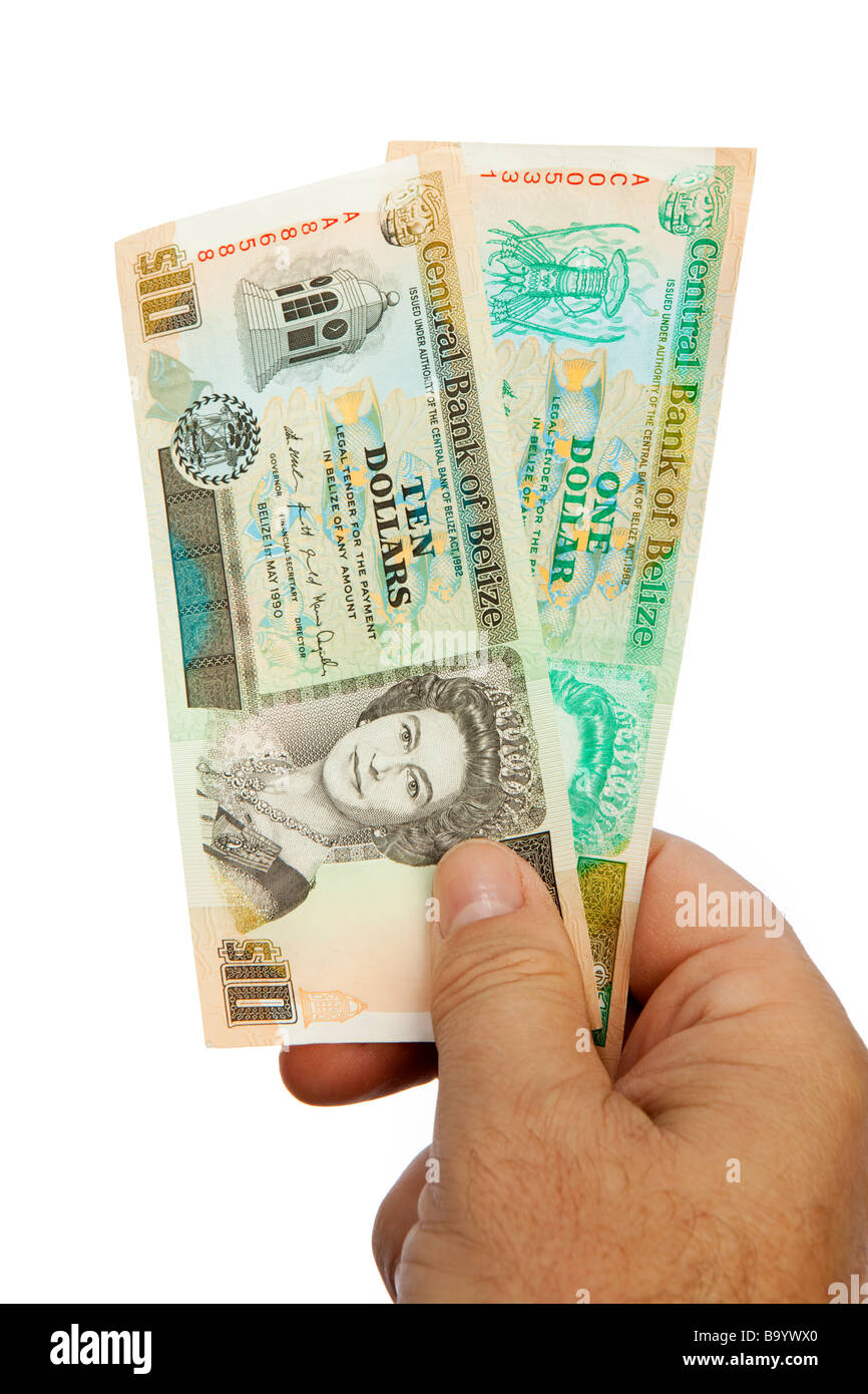Maschio di denaro mano azienda manciata di moneta Belizean Foto Stock
