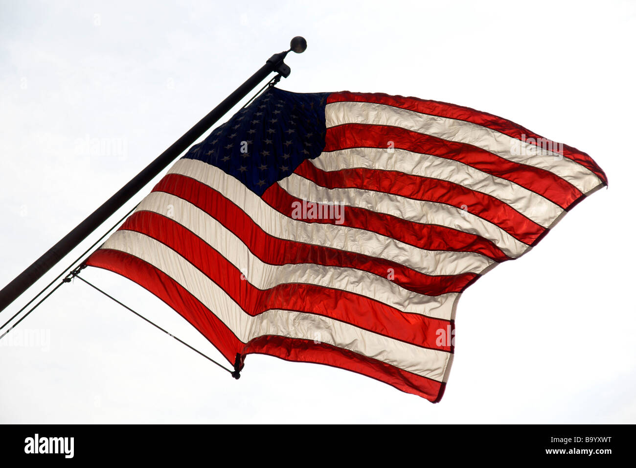 Noi bandiera retroilluminati da sole South Street Seaport Lower Manhattan New York City USA (c) Marc Jackson Fotografia Foto Stock