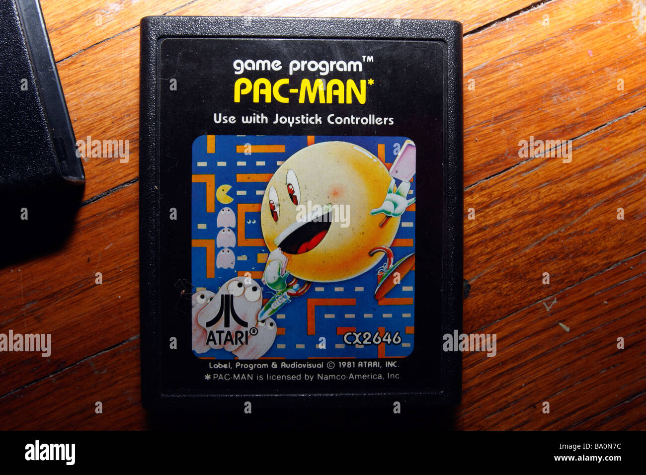 In plastica nera Atari PAC MAN e cartuccia di gioco. Foto Stock