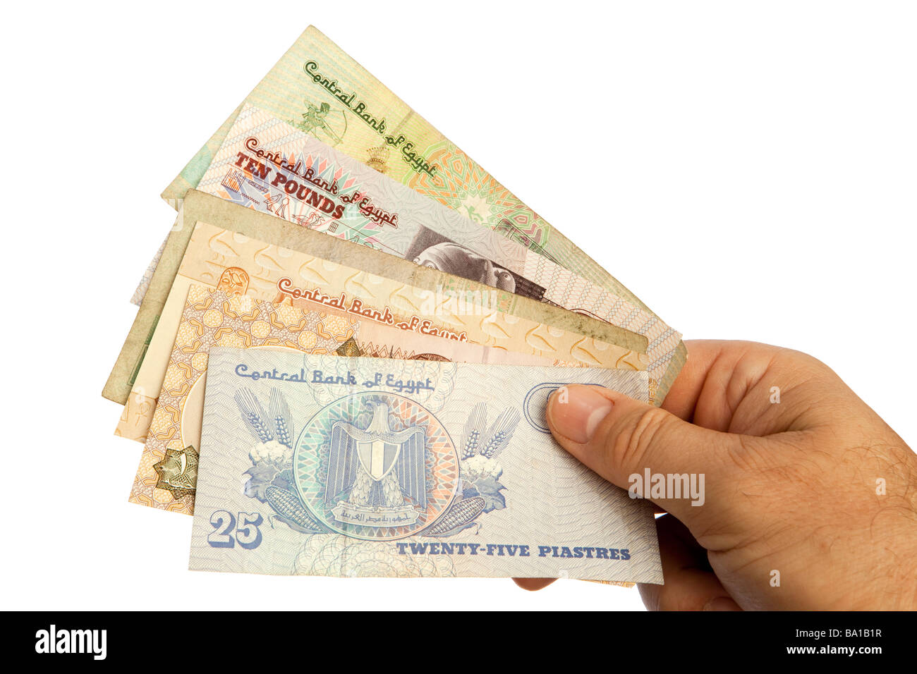 Maschio di denaro mani manciata di valuta egiziana Foto Stock