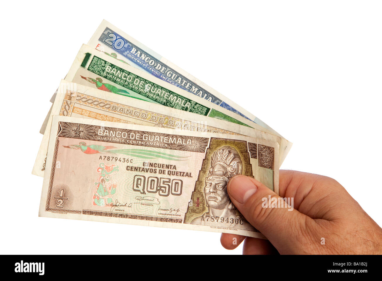 Maschio di denaro mano azienda manciata di moneta guatemalteca Foto Stock