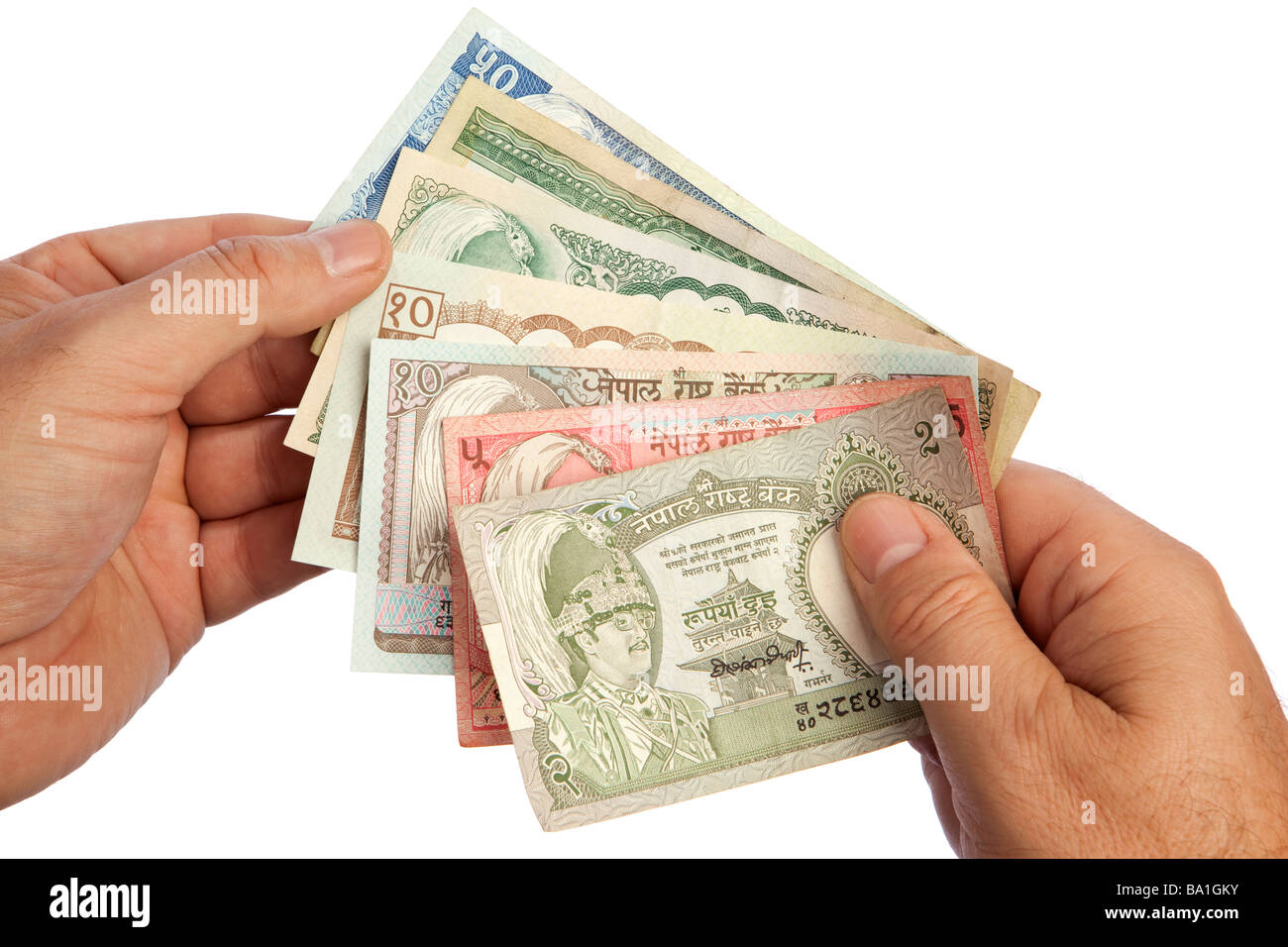 Maschio di denaro mani manciata di moneta nepalese Foto Stock