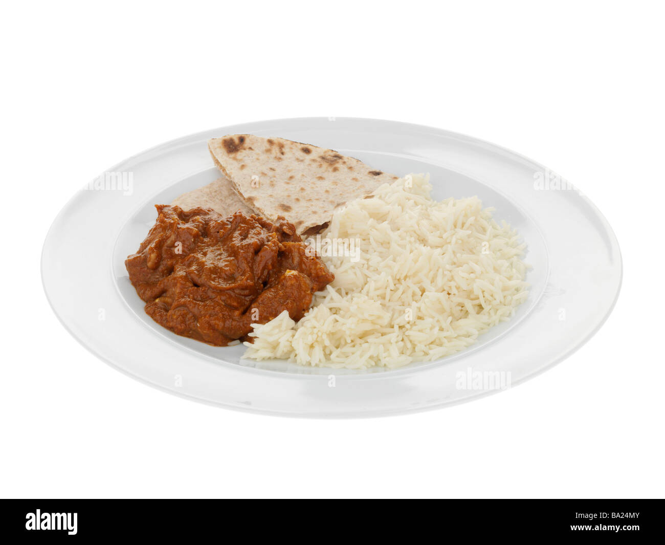 Appena cucinato in Stile Indiano Hot manzo piccante Madras Curry con riso Basmati isolata contro uno sfondo bianco con nessun popolo e un tracciato di ritaglio Foto Stock