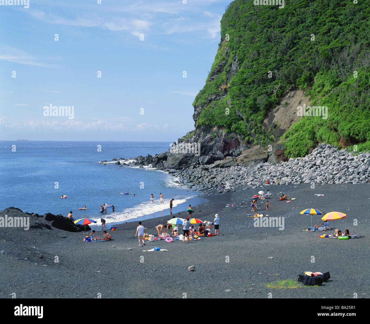 Gruppo di persone che godono a Noda Beach Foto Stock