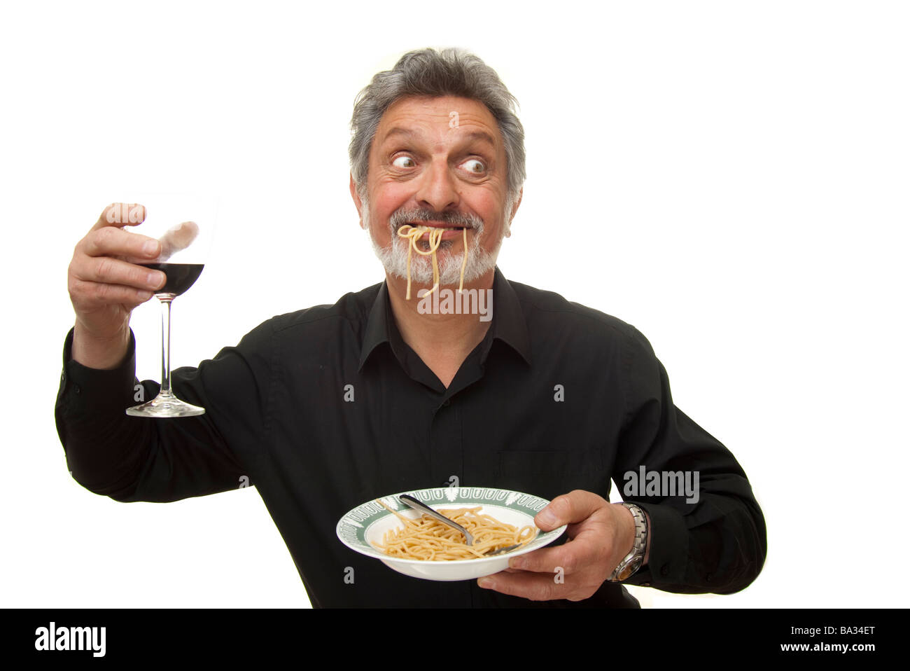 L'uomo mangiare pasta Foto Stock